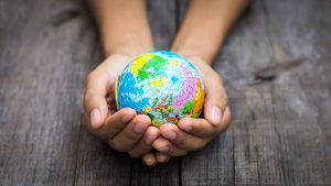 Person holding a world
