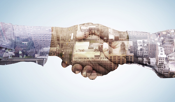 Composite image of hand shake in front of wires cityscape, business hand shake, hallmark nameplate