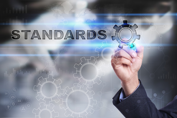 Businessman is drawing on virtual screen. standards concept Businessman is drawing on virtual screen. standards concept